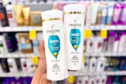 hand holding two pantene shampoos