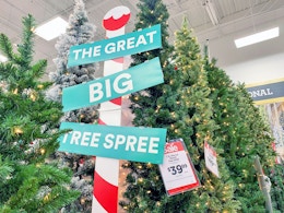 Christmas trees on display at Michaels with a sign that reads, "The Great Big Tree Spree"