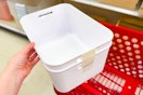 hand holding a 2-pack of brightroom storage tubs at target