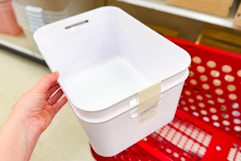 hand holding a 2-pack of brightroom storage tubs at target