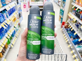 hand holding dove dry spray