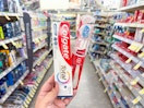 hand holding colgate oral care in walgreens