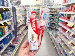 hand holding colgate oral care in walgreens