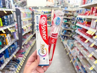 hand holding colgate oral care in walgreens