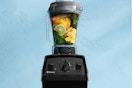  Vitamix Explorian E310 Blender against a blue wall.
