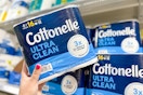 person grabbing a pack of cottonelle toilet paper from the shelf