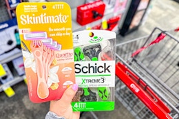 hand holding disposable razors in cvs