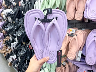hand holding no boundaries puffy flip flops at walmart
