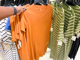 hand holding women's t-shirt dress