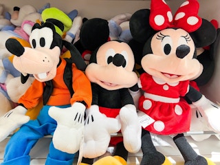 goofy, minnie and mickey mouse on a display in a store