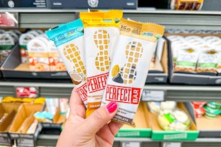 hand holding perfect bars at aldi