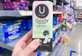 package of u by kotex security liners held in front of tampons