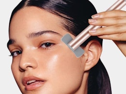 a person using a facial wand on their face