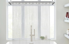 a clear shower curtain liner in front of a bathtub