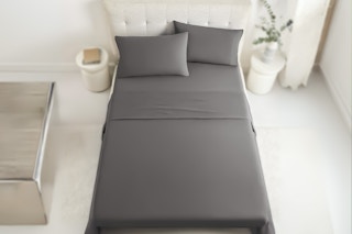 Lifestyle image of Casual Living Enzyme Comfort Bed Sheets on bed in a canvas color scheme