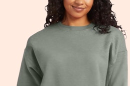 Woman wearing crewneck sweatshirt.