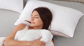 a person laying on a pillow 