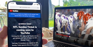 person holding phone next to laptop showing youtube nfl sunday ticket screenshots