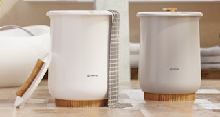 towel warming buckets on a bathroom floor