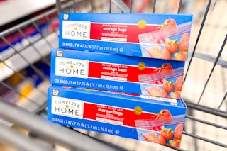 three boxes of complete home storage bags inside cart