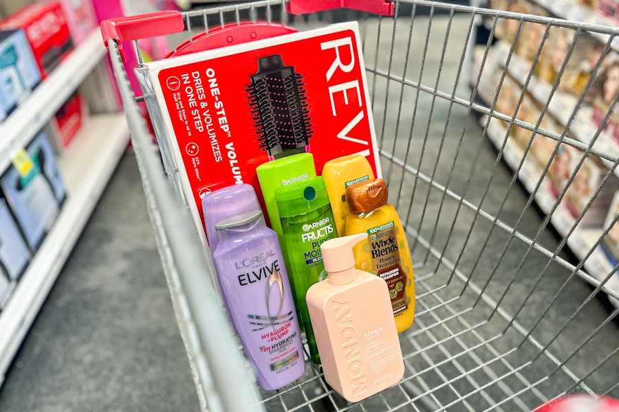 revlon one-step, monday, garnier, and loreal shampoos in a cart