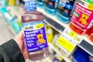 hand holding up a bottle of dg health electrolyte solution