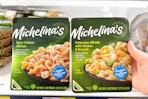 hand grabbing a michelina's frozen meal