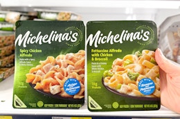 hand grabbing a michelina's frozen meal