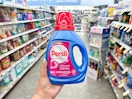 hand holding persil detergent in walgreens