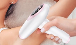 a person using a hair removal device under their arms