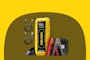 A yellow rectangular jump starter has a red clamp and a black clamp for use on a car battery. It also has 2 USB cables included.