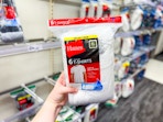 hand holding a 6-pack of hanes men's tees at target