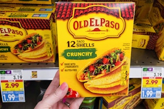 hand holding a box of old el paso taco shells at kroger