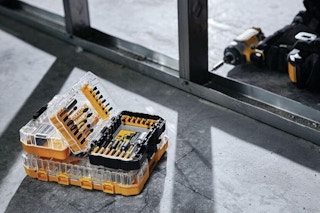 a man using a dewalt drill bit set