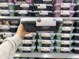 Mainstays Meal Prep Food Storage Set held p in front of other alike containers in Walmart