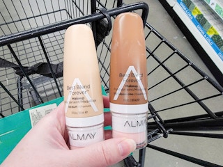 hand holding bottles of foundation