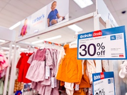 carter's baby outfits sitting on a target shelf