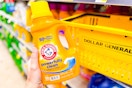 hand holding arm & hammer laundry detergent