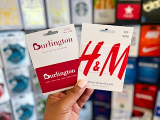 hand holding two gift cards