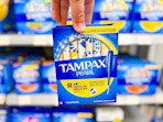Tampax Pearl Tampons held up in the feminine hygiene aisle at Walmart