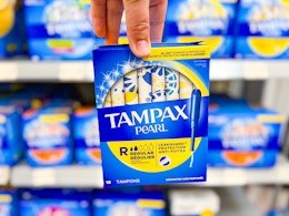 Tampax Pearl Tampons held up in the feminine hygiene aisle at Walmart