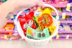 hand holding basket with easter candy