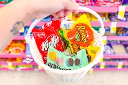 hand holding basket with easter candy