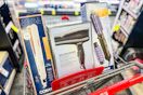 conair flat iron, hair dryer, and volume brush in a cart
