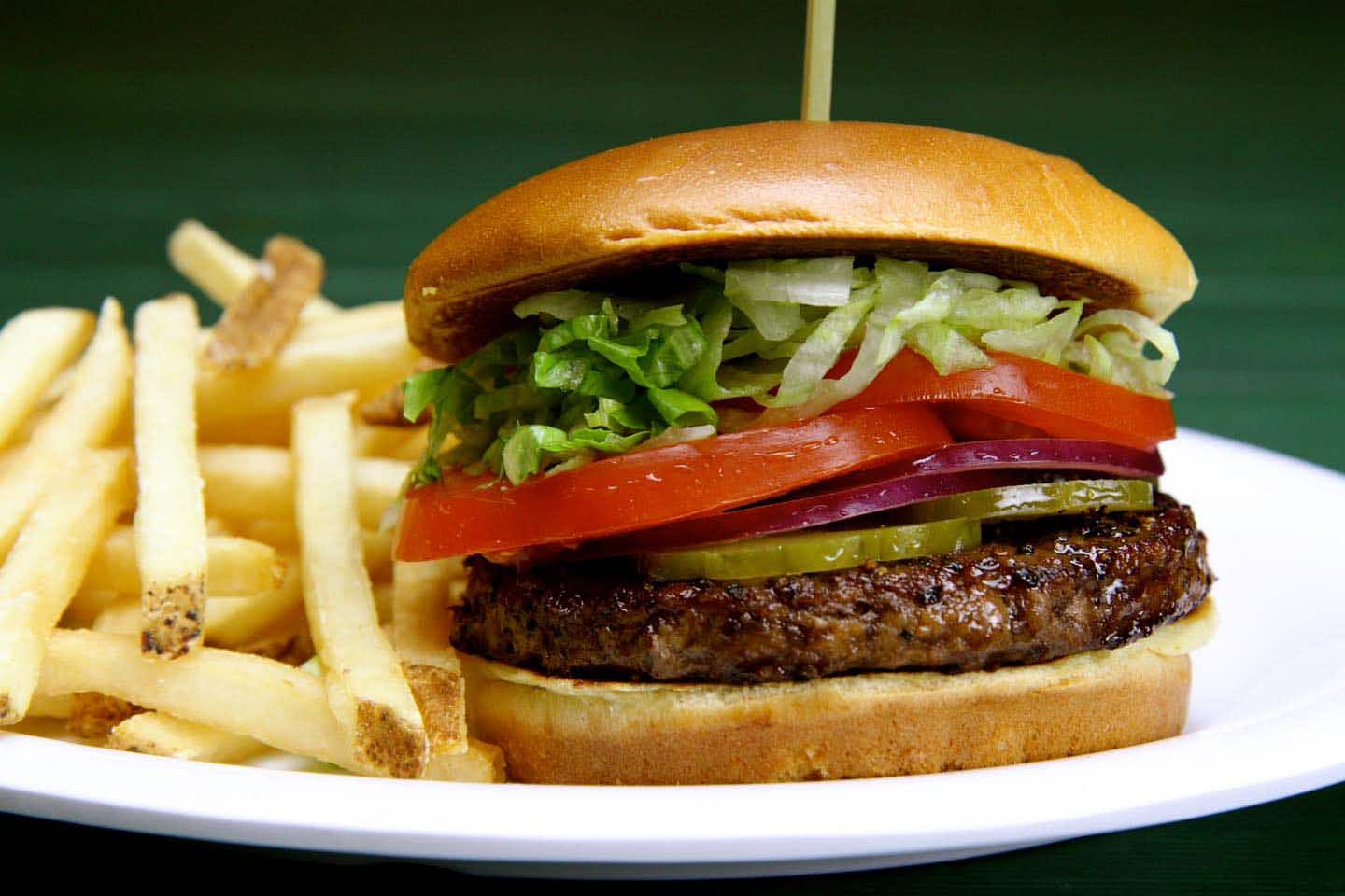 A close up on a Beef 'O' Brady's hamburger and fries