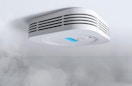 a smoke detector on a ceiling