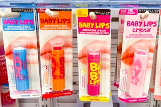 store product shelf with lip balms hanging on shelf hooks