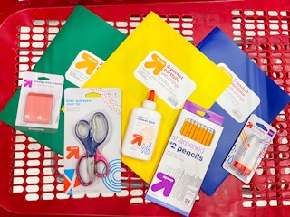a pile of school supplies in a target shopping cart