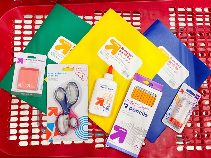 a pile of school supplies in a target shopping cart