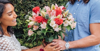flowers with free delivery - A beautiful bouquet of flowers being handed to someone